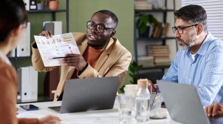 Professional advisor reviewing transformation scorecard documents